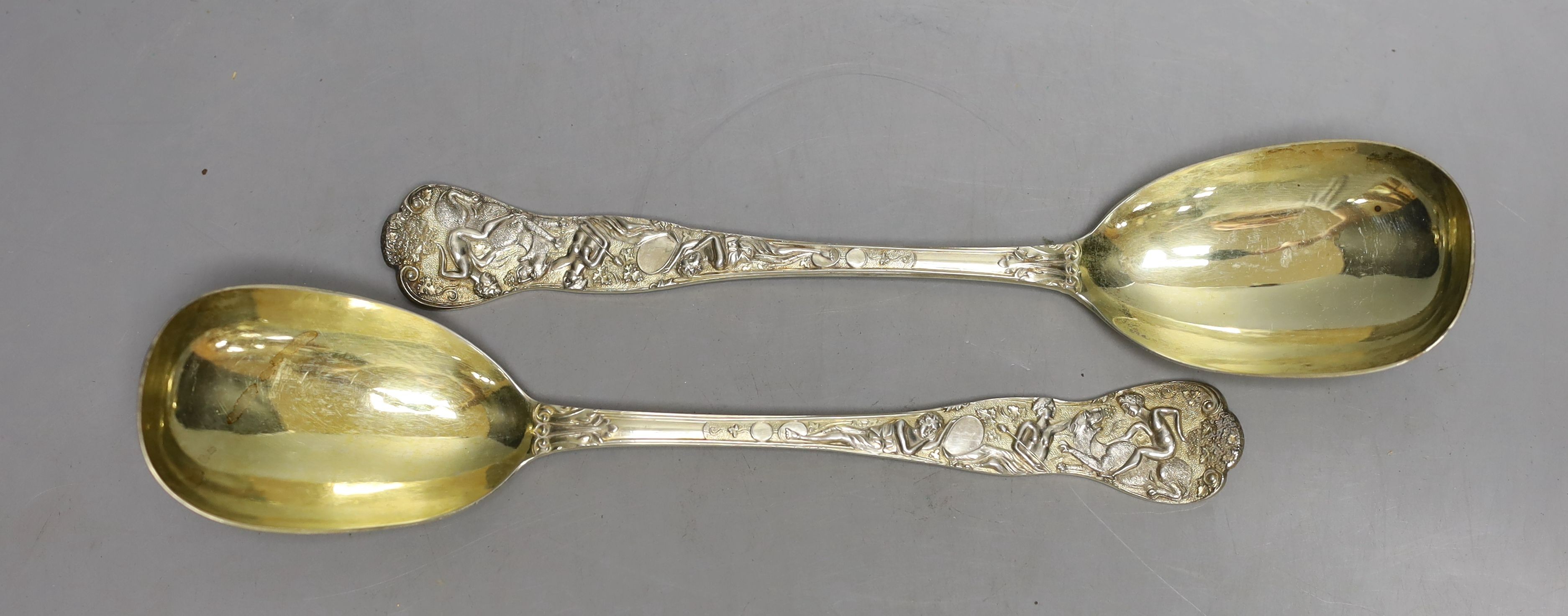 An ornate pair of Victorian silver gilt serving spoons, Lias & Lias, London,1874, 20.6cm, 6.4oz.